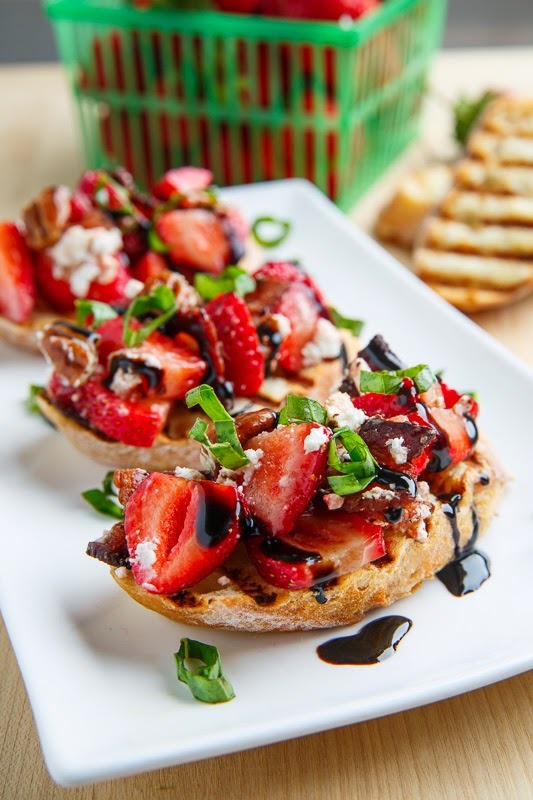 Strawberry bruschetta with bacon, candied pecans, and goats cheese with a balsamic drizzle